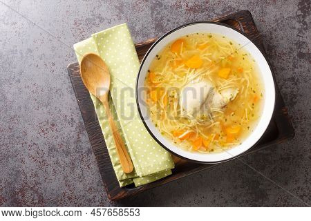 Polish Rosol Z Kury Chicken Soup With Vermicelli And Vegetables Close-up In A Bowl On A Wooden Tray 
