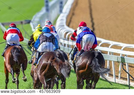 Horse Racing Jockeys Horses In Closeup Rear Behind Speed  Action Photo