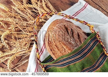 Fresh Oven Baked Homemade Sourdough Bread In Folklore Bag. Bulgarian Traditions And Symbol Of Farmla