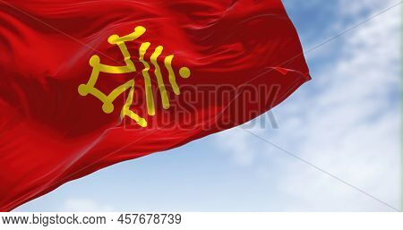 The Flag Of Occitanie Region Waving In The Wind On A Clear Day. Occitanie Is The Southernmost Admini