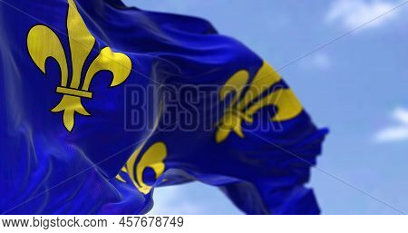 The Flag Of Ile De France Region Waving In The Wind On A Clear Day. Ile De France Is The Most Populo