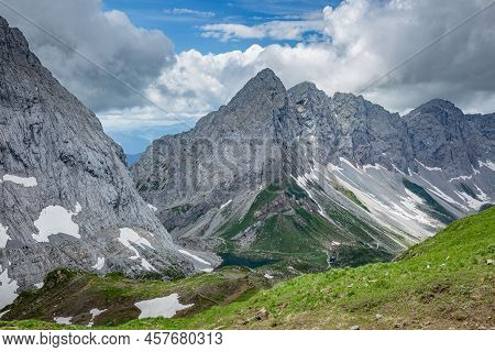Mountain Hiking Trail Road. Grey Sky Before Thunderstorm. Between Italy And Austria: Near Volaia Lak
