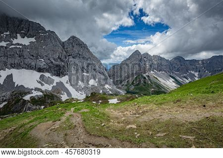 Mountain Hiking Trail Road. Grey Sky Before Thunderstorm. Between Italy And Austria: Near Volaia Lak