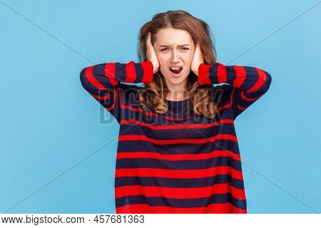 Dont Want To Listen Anymore. Angry Irritated Woman Covering Ears With Hands To Stop Hear Annoying Ta