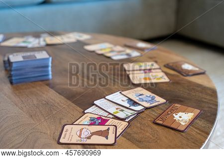 Sioux Falls, South Dakota, Usa - 2.2022 - Munchkin Card Game Being Played On A Table With Grouping O