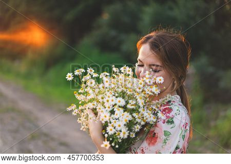 Portrait Woman With Chamomile Flowers At Sunset. Life Without Allergies, Breathe Freely. Woman Havin