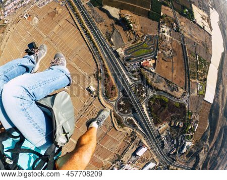 Air View Of People Couple Doing Paraglyde Adrenaline Experience - Pilot And Passenger Paraglyiding O