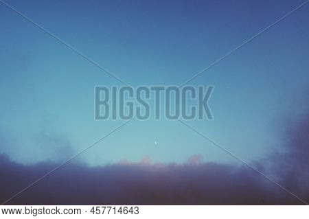 Vintage Shot Of The Cloudscape And Moon In The Sky