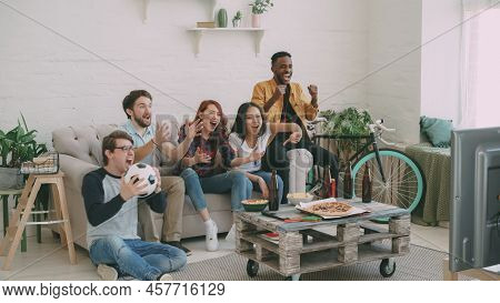 Football Fans Watching Match On Tv And Enjoying Victory Of Favourite Team While Sitting On Couch At 