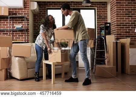Husband And Wife Moving In New House Bought On Loan, Enjoying Property Relocation Together In Apartm