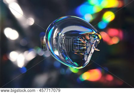 Drop Of Cosmetic Transparent Gel On A Halographic Background. The Texture Of The Serum, Heir Gel Or 