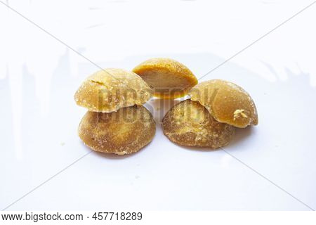 Brown Sugar Or Java Sugar Or Palm Sugar Or Gula Jawa Isolated On White Background. Top View. Flat La