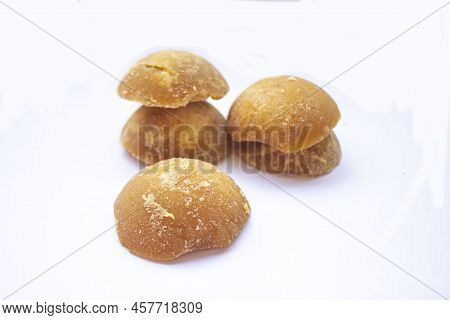 Brown Sugar Or Java Sugar Or Palm Sugar Or Gula Jawa Isolated On White Background. Top View. Flat La