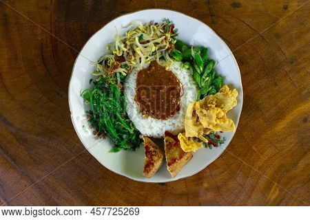 Nasi Pecel Or Sego Pecel Is Traditional Javanese Rice Dish Of Steamed Rice With Vegetable Salad, Pea