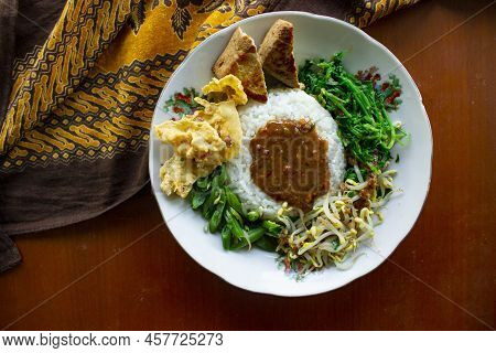 Nasi Pecel Or Sego Pecel Is Traditional Javanese Rice Dish Of Steamed Rice With Vegetable Salad, Pea