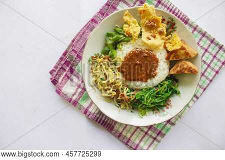 Nasi Pecel Or Sego Pecel Is Traditional Javanese Rice Dish Of Steamed Rice With Vegetable Salad, Pea