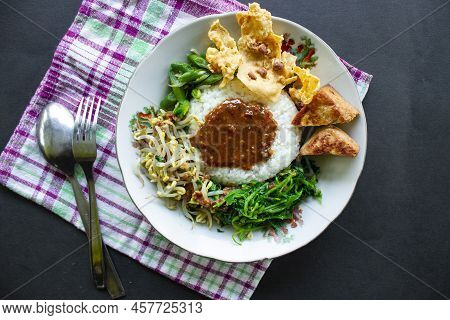 Nasi Pecel Or Sego Pecel Is Traditional Javanese Rice Dish Of Steamed Rice With Vegetable Salad, Pea