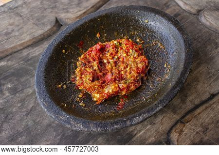 Fresh Sambal Served On Stone Mortar (cobek). Sambal Is Traditional Sauce From Indonesia Made From Ch
