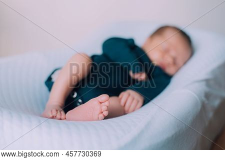 The Baby Is Lying In A Cocoon Of Copy Space . The Baby Is 0-3 Months Old. A Contented Infant. An Art