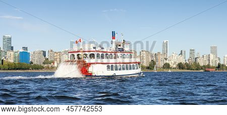 Vancouver, British Columbia, Canada - June 23, 2022: Sternwheeler Passing By Stanley Park And Citysc