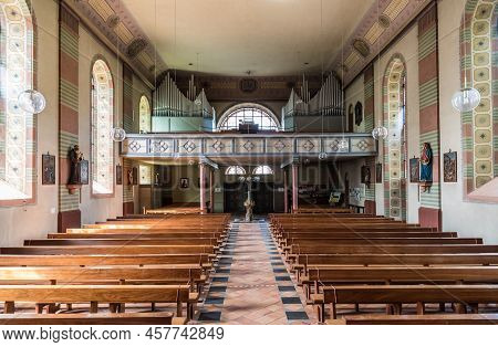 Schweich, Rhineland- Palatinate - Germany  - 04 12 2019 - Small Catholic Church With Wooden Decorati