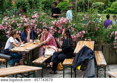 Brussels Old Town, Brussels Capital Region, Belgium - 06 26 2022 - Friends Having A Drink At The Jar