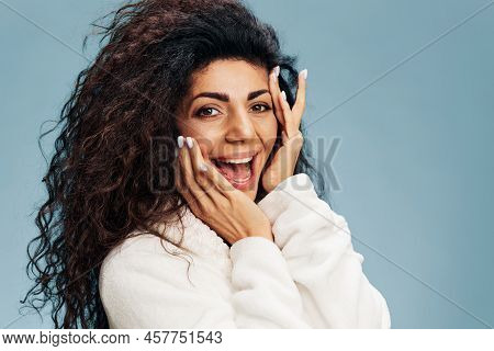 Smiling Cheerful Curly Latin Female In Bathrobe With Fresh Glowing Hydrated Facial Skin And Natural 