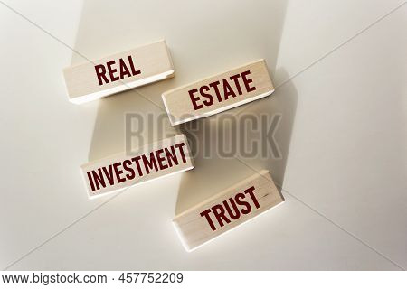 Reit Investment Fund Symbol. Conceptual Words Reit Real Estate Investment Fund On Wooden Blocks On A
