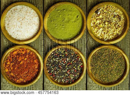 Spices And Seasonings On A Wooden Table Salt, Pepper, Za'atar, Thyme, Paprika. Rustic Style Top View