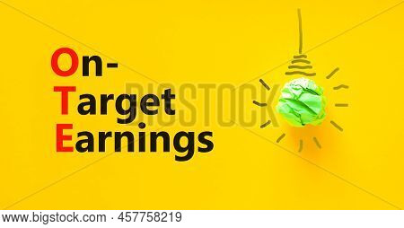 Ote On-target Earnings Symbol. Concept Words Ote On-target Earnings On Yellow Paper On A Beautiful Y