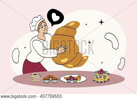 Concept Of Pastries Of Sweets And Cupcakes. Young Girl Baker Holding Huge Croissant In His Hands. Ch