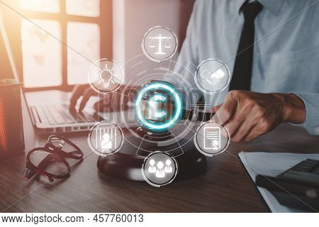 Copyright Or Patent Concept, Woman Hand Holding Judge Gavel On Desk With Vr Screen Copyright Icon Ba