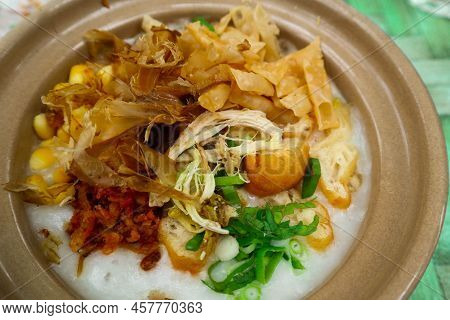 Porridge Served On Hot Claypot Topped With Chicken, Sweet Corn, Skipjack Tuna, Tofu, Green Onions, C