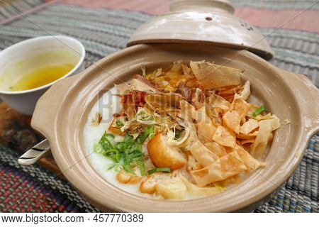 Porridge Served On Hot Claypot Topped With Chicken, Sweet Corn, Skipjack Tuna, Tofu, Green Onions, C