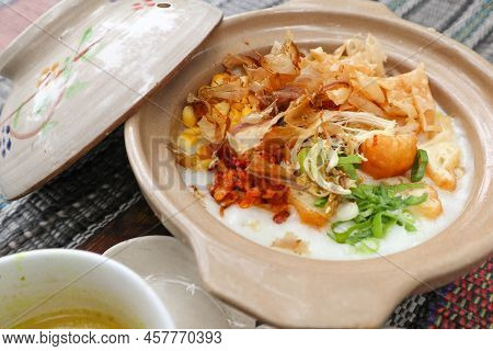 Porridge Served On Hot Claypot Topped With Chicken, Sweet Corn, Skipjack Tuna, Tofu, Green Onions, C