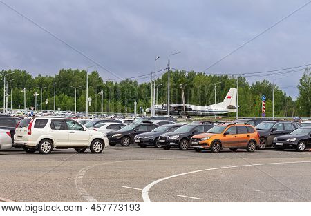 July 03, 2022 Tomsk Russia Parking Lot, Road And Cabstand Near Contemporary Airport Terminal. Soviet