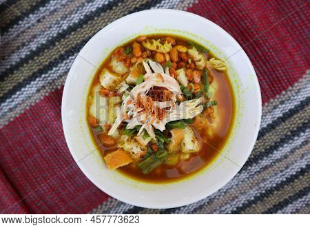 Bubur Ayam Or Chicken Porridge Or Rice Gruel, Made From Served With Shredded Chicken, Leek Slice, Be