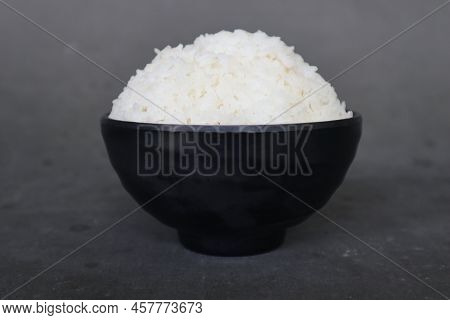 White Steamed Rice Or Nasi Putih Served In Little Bowl Isolated On White Background
