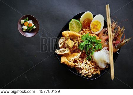 Laksa, Laksa Curry Made From Vermicelli, Noodles, Bean Sprouts, Egg, Tofu Lime, And Shrimp With A Sp