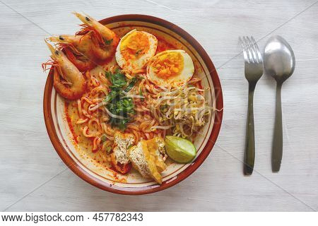 Laksa, Laksa Curry Made From Vermicelli, Noodles, Bean Sprouts, Egg, Tofu Lime, And Shrimp With A Sp
