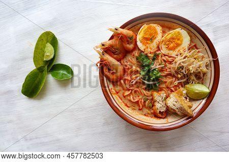 Laksa, Laksa Curry Made From Vermicelli, Noodles, Bean Sprouts, Egg, Tofu Lime, And Shrimp With A Sp