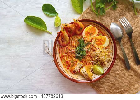 Laksa, Laksa Curry Made From Vermicelli, Noodles, Bean Sprouts, Egg, Tofu Lime, And Shrimp With A Sp