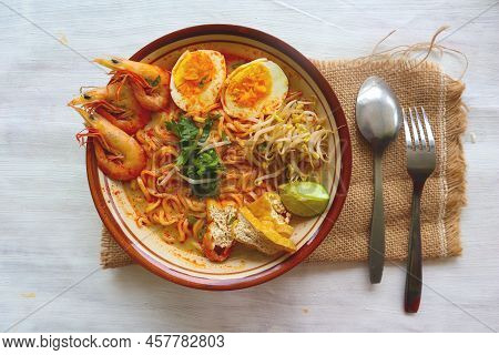 Laksa, Laksa Curry Made From Vermicelli, Noodles, Bean Sprouts, Egg, Tofu Lime, And Shrimp With A Sp