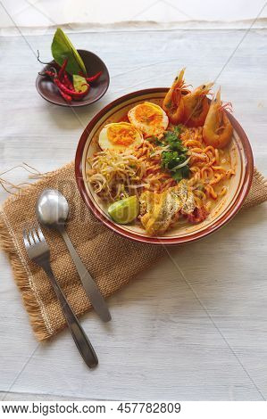 Laksa, Laksa Curry Made From Vermicelli, Noodles, Bean Sprouts, Egg, Tofu Lime, And Shrimp With A Sp