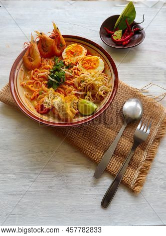 Laksa, Laksa Curry Made From Vermicelli, Noodles, Bean Sprouts, Egg, Tofu Lime, And Shrimp With A Sp