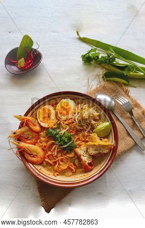 Laksa, Laksa Curry Made From Vermicelli, Noodles, Bean Sprouts, Egg, Tofu Lime, And Shrimp With A Sp