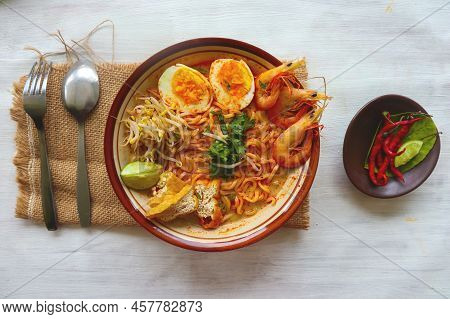 Laksa, Laksa Curry Made From Vermicelli, Noodles, Bean Sprouts, Egg, Tofu Lime, And Shrimp With A Sp