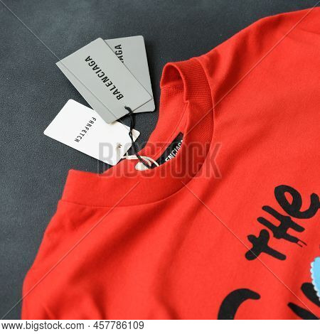 Nikopol, Ukraine, July 1,2022: Top View Male Red Balenciaga T-shirts. New T-shirt With Tags. Clothin