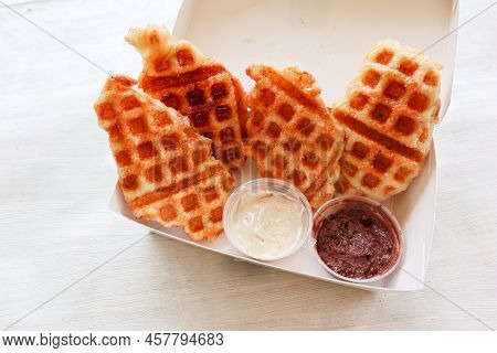 Croissant Waffle Or Croffle With Chocolate Sauce Served In Box And White Background