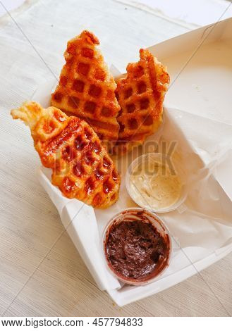Croissant Waffle Or Croffle With Chocolate Sauce Served In Box And White Background